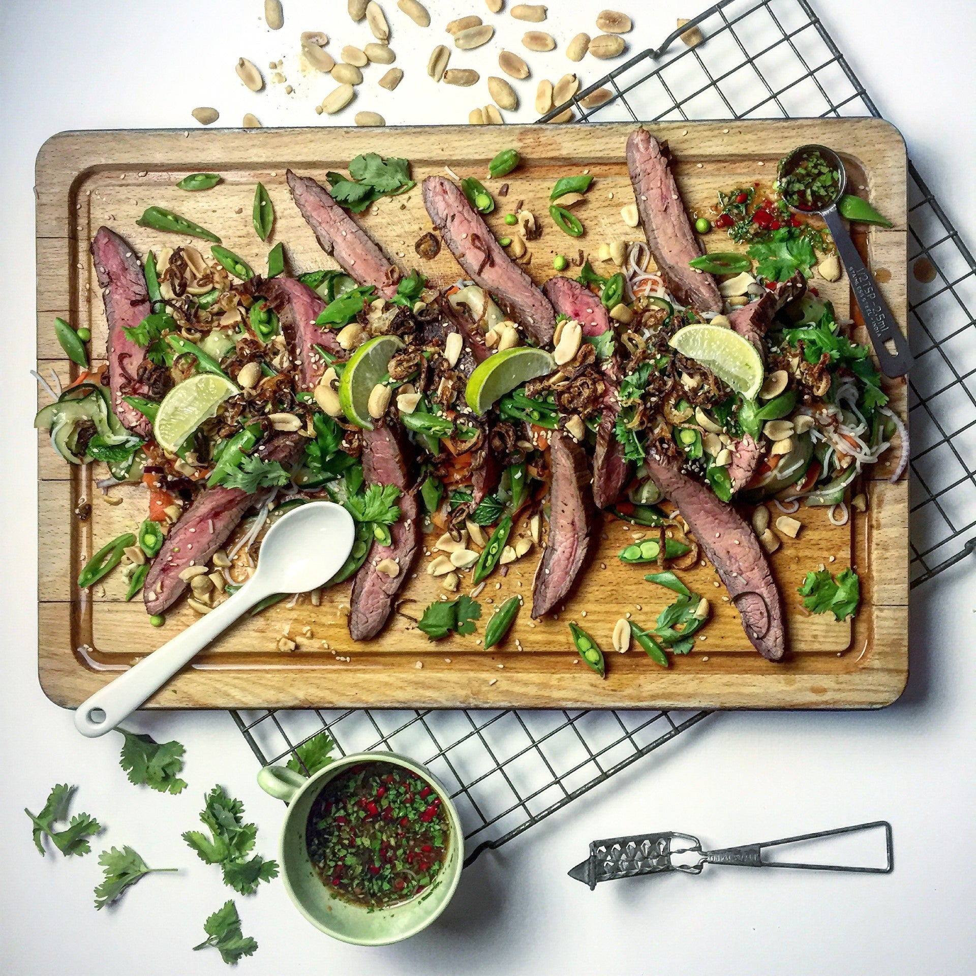 Steak salad on a wooden serving board 